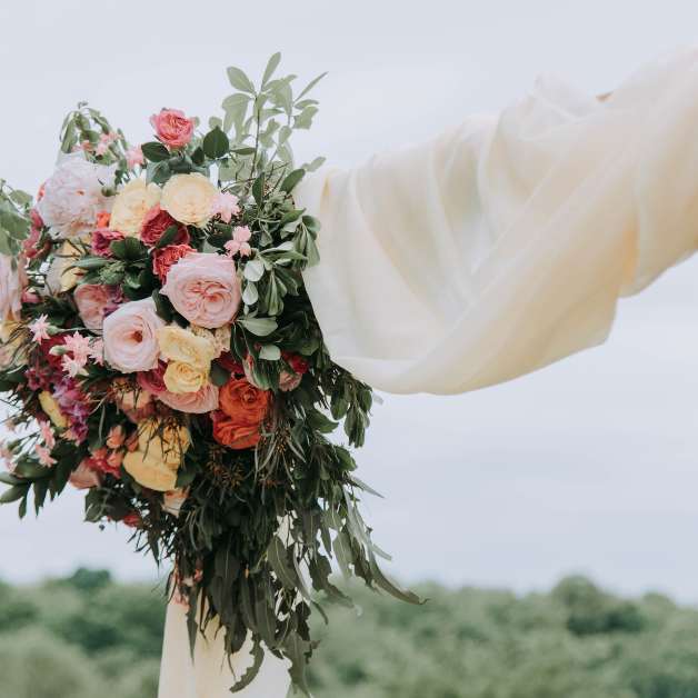 Is it cheaper to have real or silk flowers for a wedding?